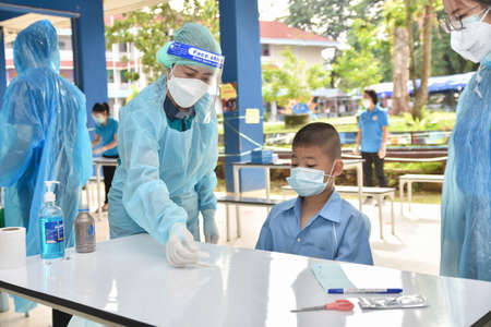 10Nov 2021; Chiang Rai, Thailand:Teachers use rapid self-testing antigen kits. (atk)Covid-19 test for studentsのeditorial素材