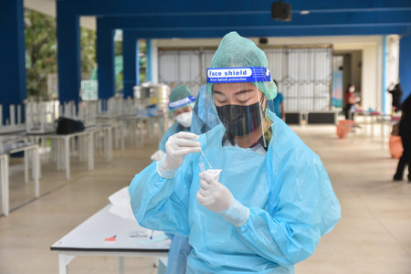 10Nov 2021; Chiang Rai, Thailand:Teachers use rapid self-testing antigen kits. (atk)Covid-19 test...