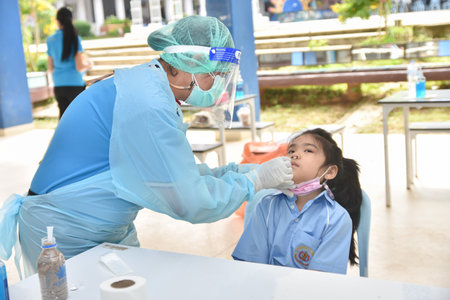 10Nov 2021; Chiang Rai, Thailand:Teachers use rapid self-testing antigen kits. (atk)Covid-19 test for studentsのeditorial素材