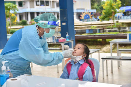 10Nov 2021; Chiang Rai, Thailand:Teachers use rapid self-testing antigen kits. (atk)Covid-19 test for studentsのeditorial素材