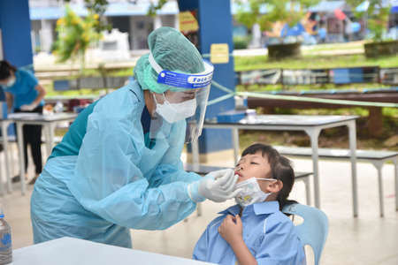 10Nov 2021; Chiang Rai, Thailand:Teachers use rapid self-testing antigen kits. (atk)Covid-19 test for studentsのeditorial素材