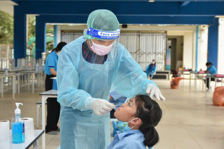 10Nov 2021; Chiang Rai, Thailand:Teachers use rapid self-testing antigen kits. (atk)Covid-19 test for studentsのeditorial素材