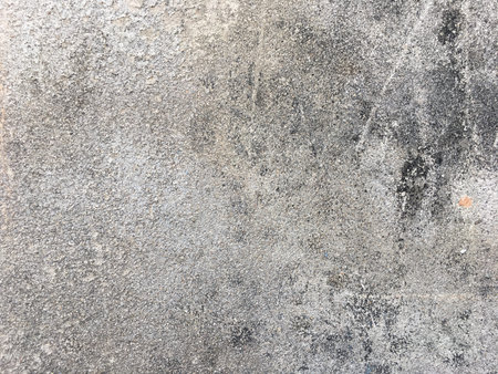 Old wall with decayed plaster cement and peeling texture background of cement color wallpaperの写真素材