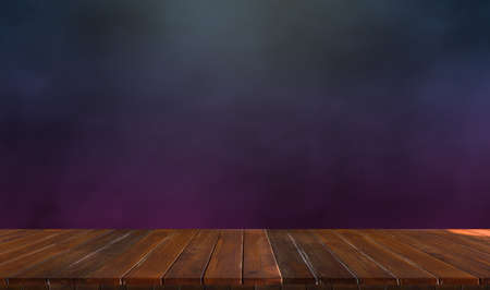 lonely empty wooden table on dark and smoky background to simulate your productの写真素材