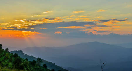 Colorful sunset over the mountain hills Thailandの写真素材