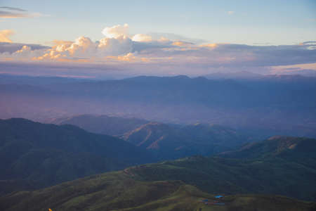 Sunset, mountains and beautiful clouds at Doi Chang, Mae Fah Luang Village, Chiang Rai, Thailandの写真素材
