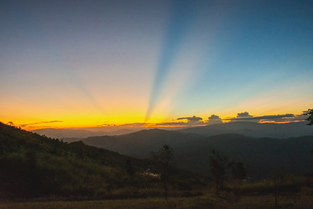 Sunset, mountains and beautiful clouds at Doi Chang, Mae Fah Luang Village, Chiang Rai, Thailandの写真素材