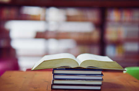 Open book on the table in libraryの写真素材