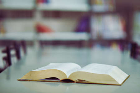 Open book on the table in libraryの写真素材