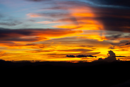 Golden yellow evening sky in summer Thailandの写真素材