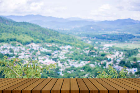 wooden table and beauty blur sky and mountains as backgroundの写真素材