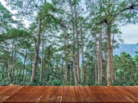 wooden table and beauty blur sky and mountains as backgroundの写真素材
