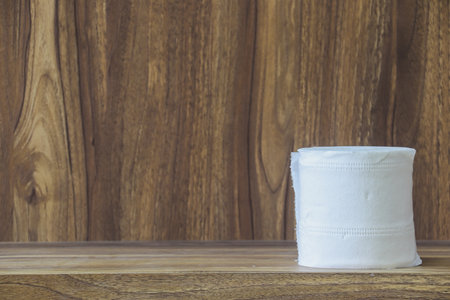White tissue paper on wooden table with copy space for vintage style wood grain background design.の写真素材