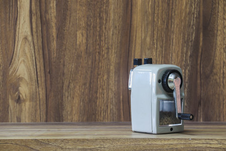 stapler placed on wooden table with copy space for vintage style wood grain background designの写真素材