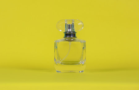 perfume bottle
laid on a yellow background with copy space for designの写真素材