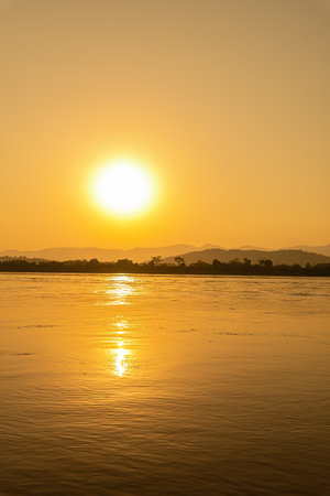 Beautiful sunset on the Mekong River, Laos. The Mekong River is the longest river in Laos.の写真素材