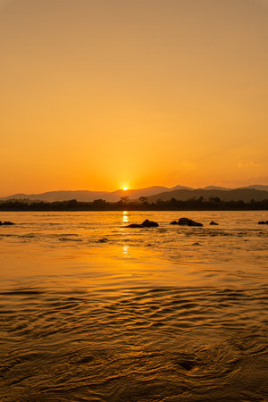 Sunset on the Mekong River in Laos, South East Asiaの写真素材