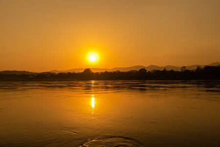 Sunset on the Mekong River in Laos, Southeast Asia.の写真素材