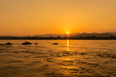 Sunset on the Mekong River in Laos. The Mekong River is the largest river in Laos.の写真素材
