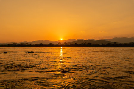 Beautiful sunset over the Mekong River in Laos, Asia.の写真素材