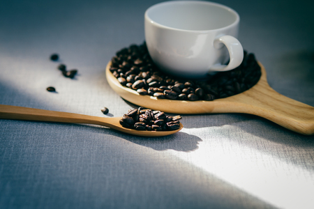 coffee bean on wooden gray cloth backgroundの写真素材