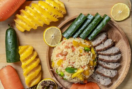 Pineapple fried rice In a wooden dish ,Thailand food, cookingの写真素材