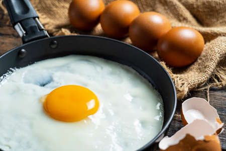 Fried eggs in a pan ready to eat in the morning.の写真素材