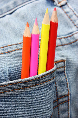 crayons in jeans pocket の写真素材