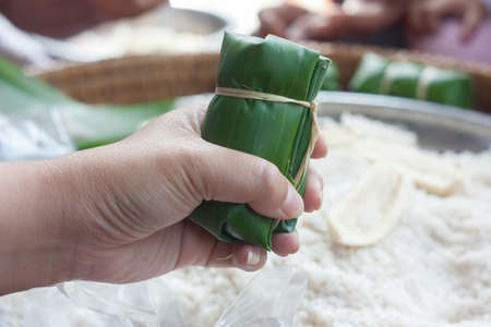 Bunch of rice in Thailand Thai dessert made from banana and glutinous rice, wrap with banana lea の写真素材