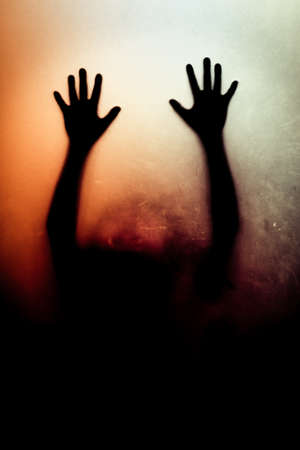 shadow behind a glass doorの写真素材