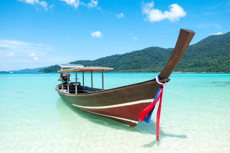 Long tail boat sit on the beachの写真素材