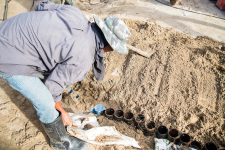 Worker laying drainage pipes
