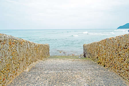 path to the sea, with stone steps.の写真素材