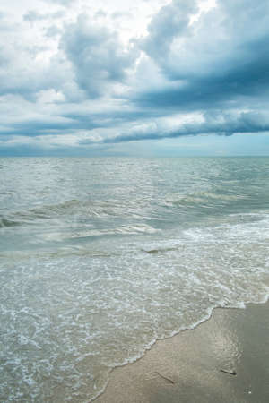 Stormy sky with clouds in the rain over the seaの写真素材