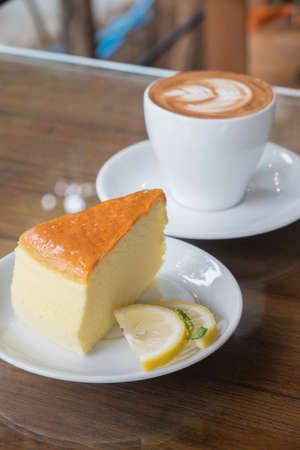 cappuccino and orange cakeの写真素材