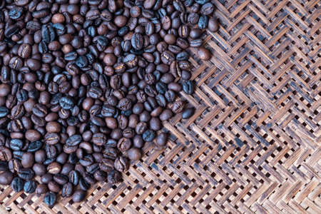 Roasted coffee beans on bamboo basketの写真素材