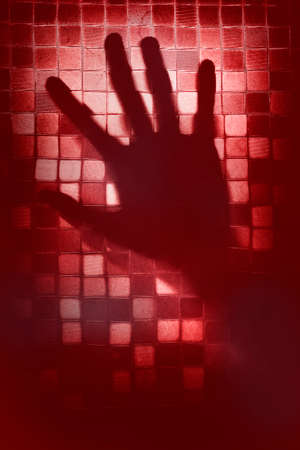 Mysterious hand behind a glass door - Imageの写真素材