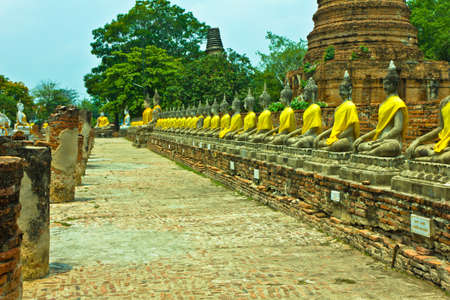 Row of Buddha image at Wat Yai Chaimongkhon in Ayutthaya , Thailandの写真素材