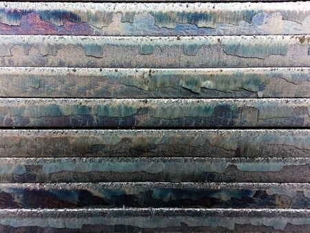 Steel sheet is then cut out overlapping layers.の写真素材