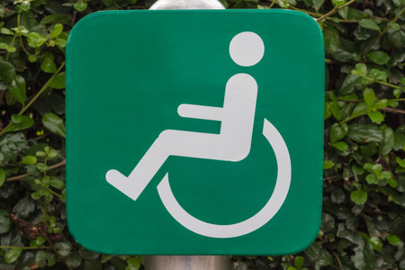 Signs for people with disabilities is green sheet. Located places everywhere