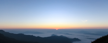 Colorful morning sunrise and morning mist and fog is white, very beautiful.の写真素材