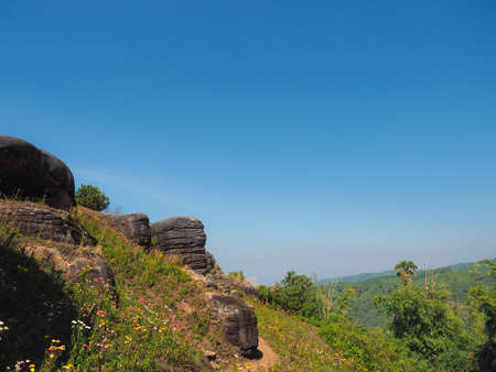 Big rocks on the cliff, mountain view with blue sky, back groundの写真素材
