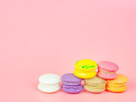 colorful macaron or macaroon on pink background
