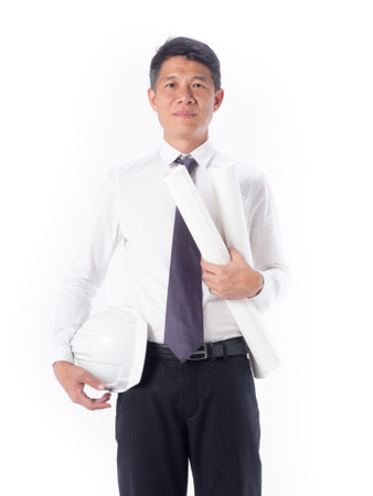 Portrait asia construction engineer handsome man white shirt black pants holding helmet and blueprints isolated on whiteの写真素材