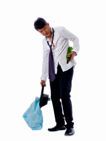 drunk business asia man wear black suit holding wine bottle and steering wheel with air bag on  isolated white backgroundの写真素材