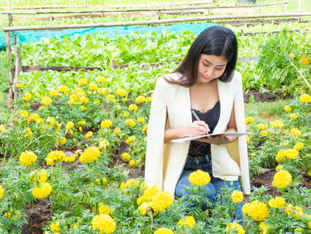 asia business woman farmer smily in gardenの写真素材