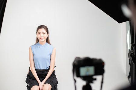 A woman take photo in studioの写真素材