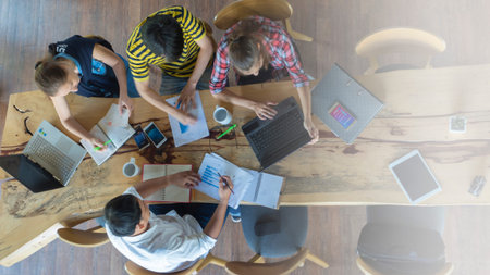 A group working together on a wooden table