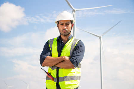 engineer team working in wind turbine farm. Renewable energy with wind generator by alternative energy concept.の写真素材