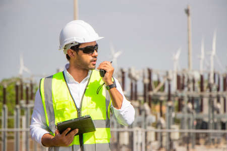 engineer team working in wind turbine farm. Renewable energy with wind generator by alternative energy concept.の写真素材